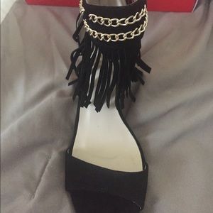 Black suede and fringe open toe shoes