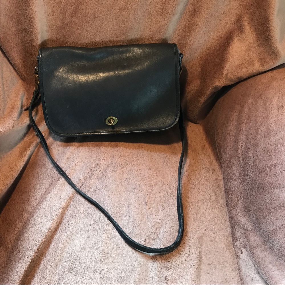 Well loved, timeless navy Coach handbag