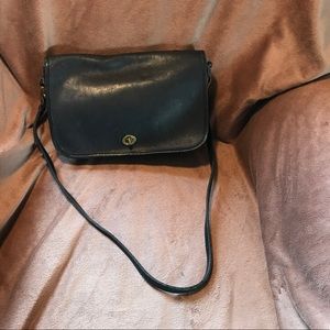 Well loved, timeless navy Coach handbag