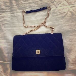 Black cushioned cross body bag and clutch