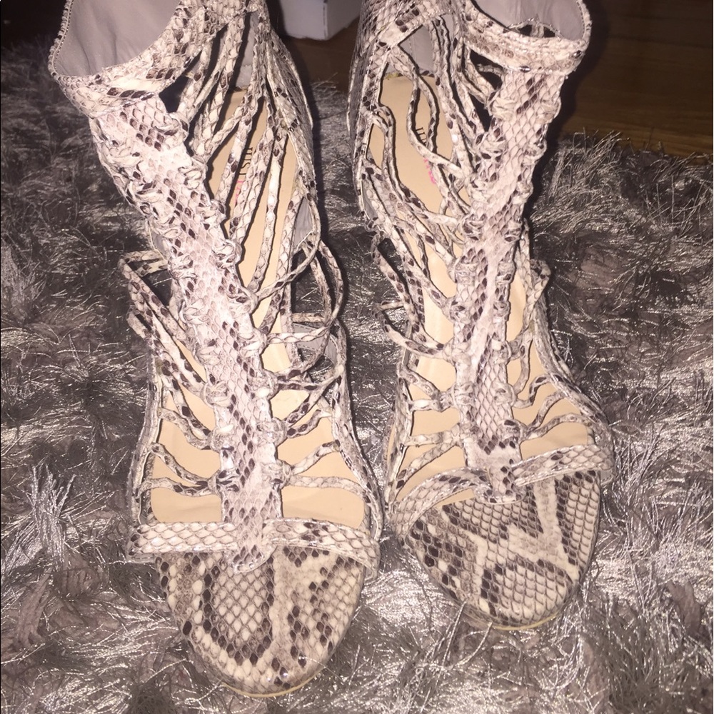 Never worn, size 11, faux snake skin heels