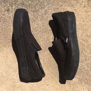 All black slip-on vans