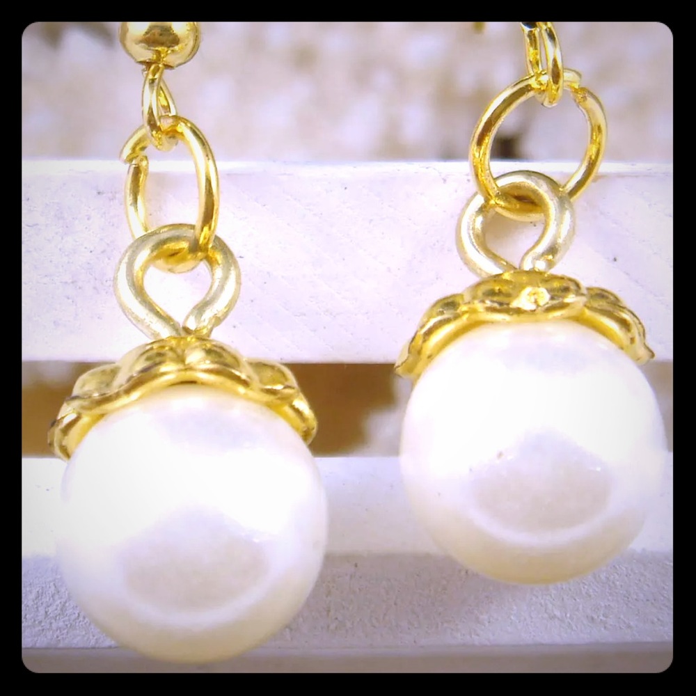 Large pearl and gold hook dangle earrings