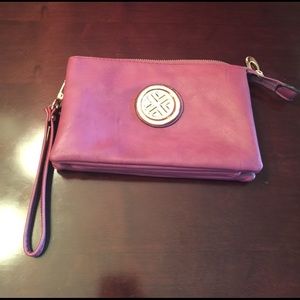 Plum color cross-body/wristlet purse. Never used.