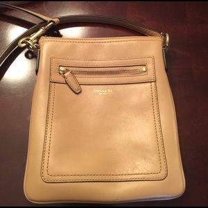 Tan Coach crossbody purse.