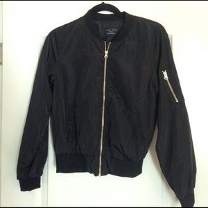Black Bomber Jacket with Gold Zippers.