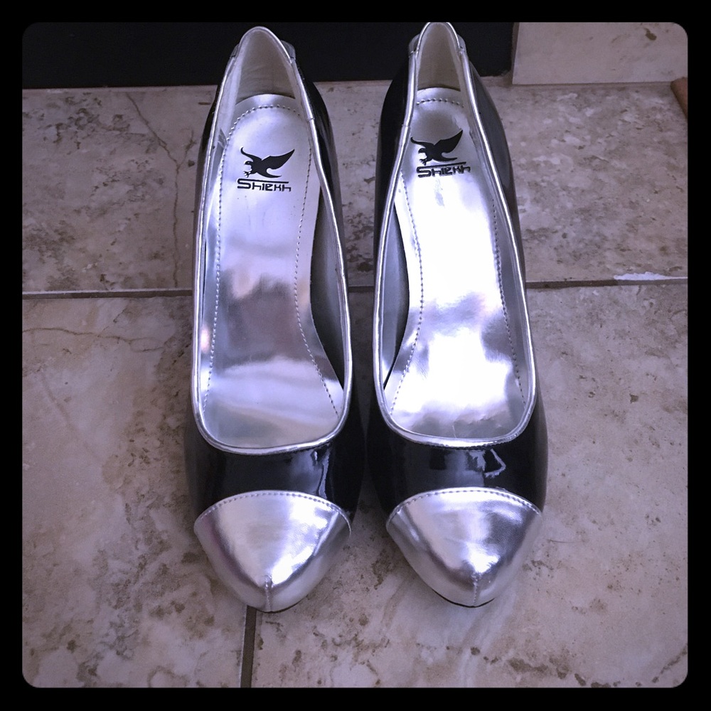 Silver and black heels.