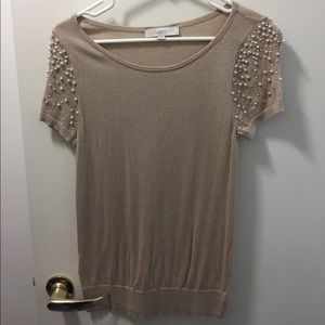 Adorable tan top with pearl and rhinestone details