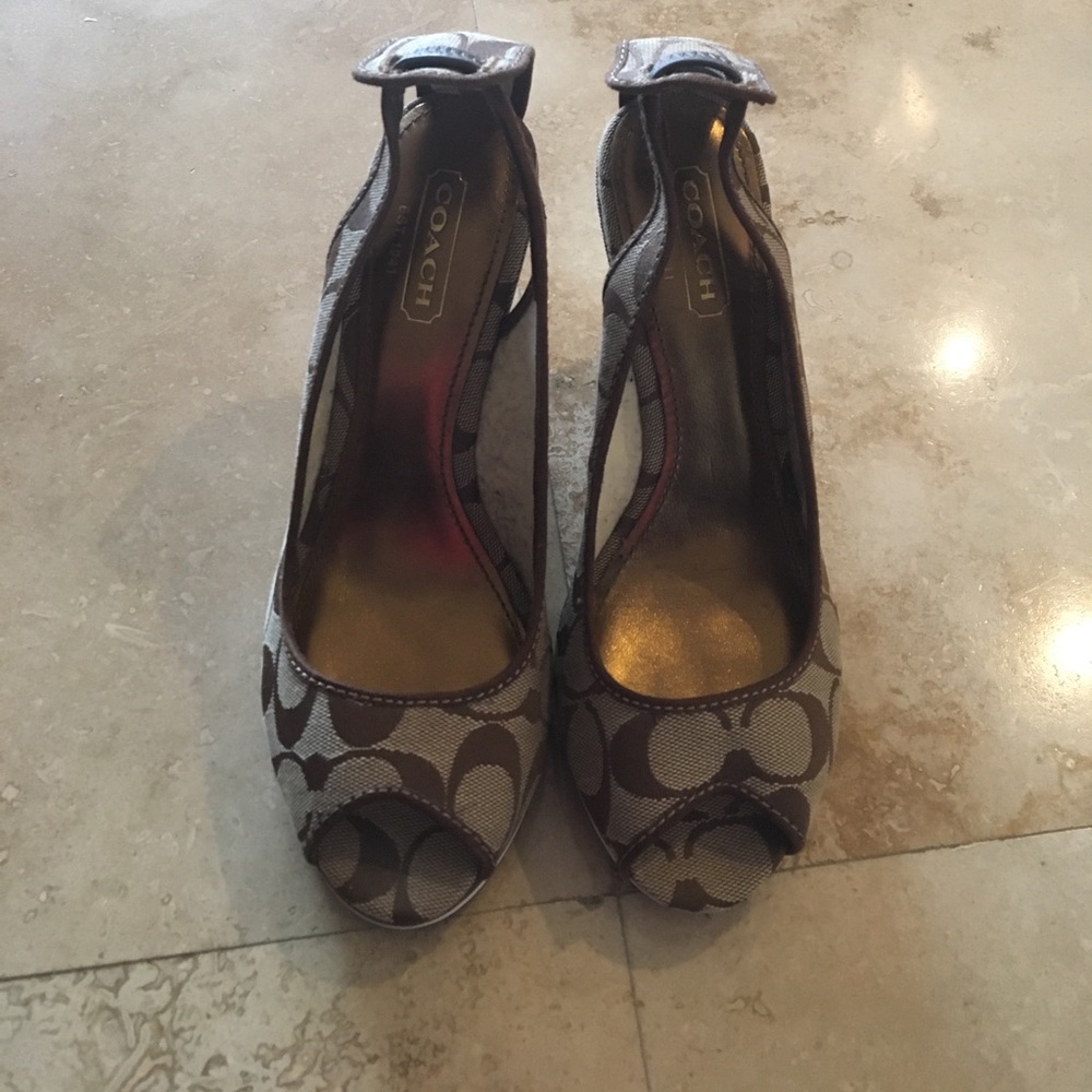 Never been worn 100% authentic Coach wedges