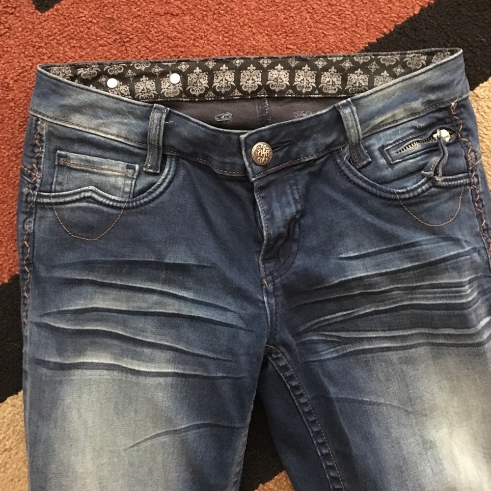 Dark skinny jeans with fade.