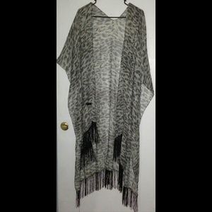 Leopard print shawl/kimono with fringe trim.