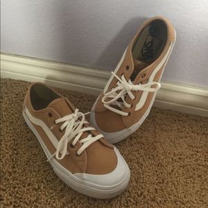 Tan and white women's Vans sneakers