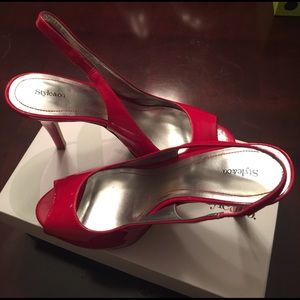 Strawberry red 4" inch open toe heels.