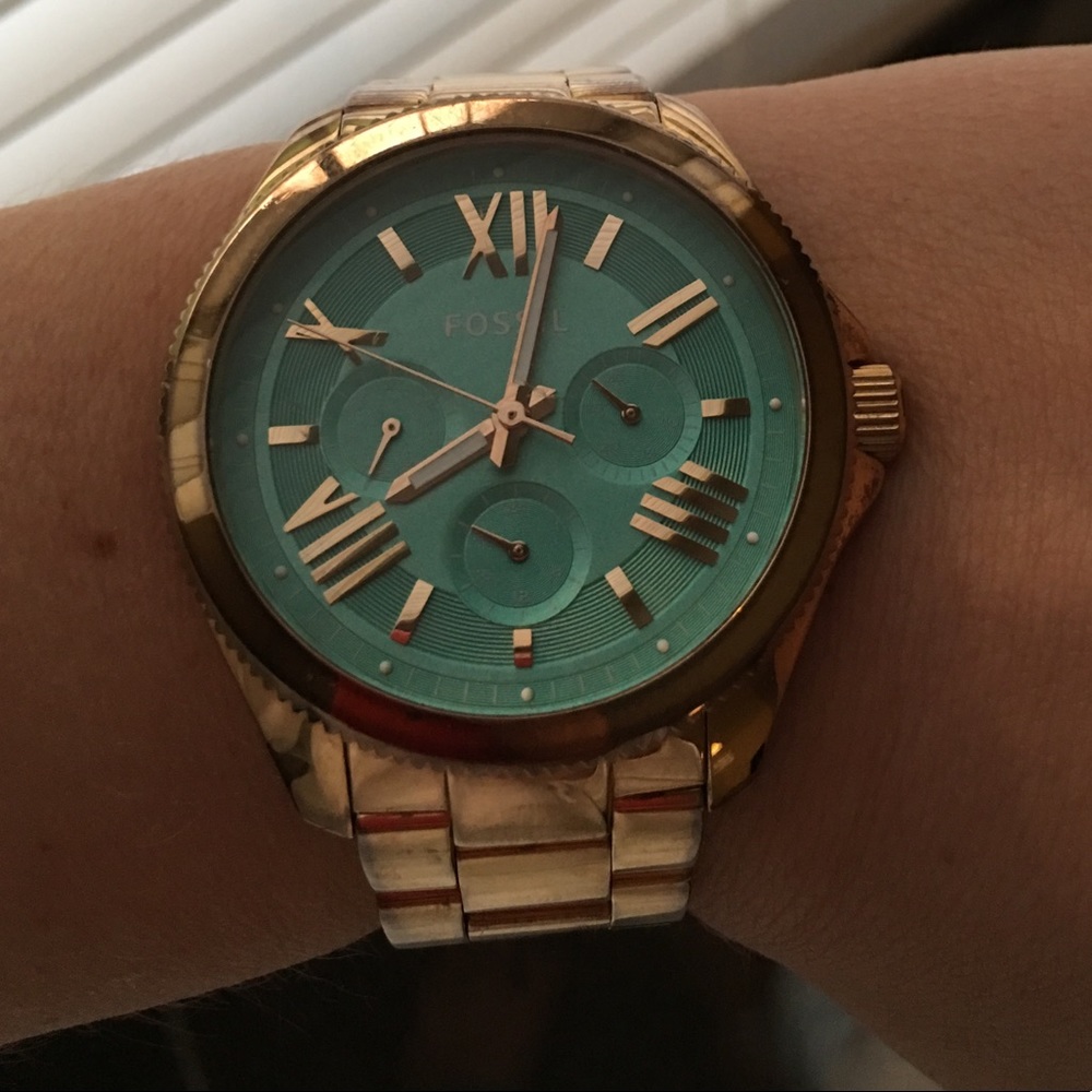 Mint faced, gold fossil watch