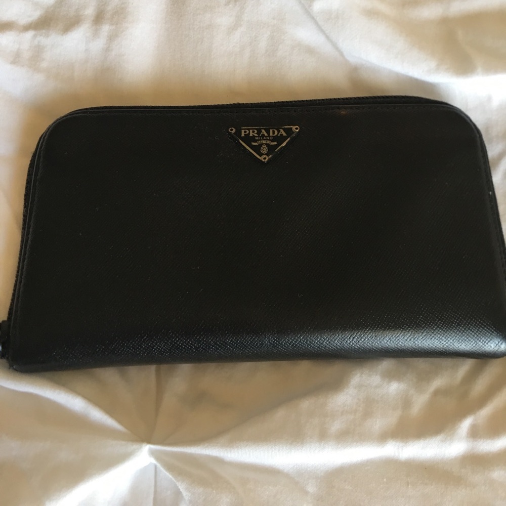 Authentic Prada Black leather zip around wallet.