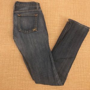 Medium Wash slightly distressed skinny jeans