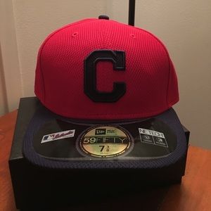 On field Cleveland Indian baseball hat.