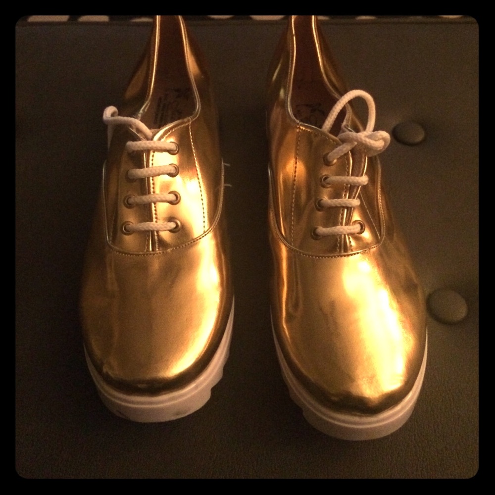 Metallic gold tennis shoes