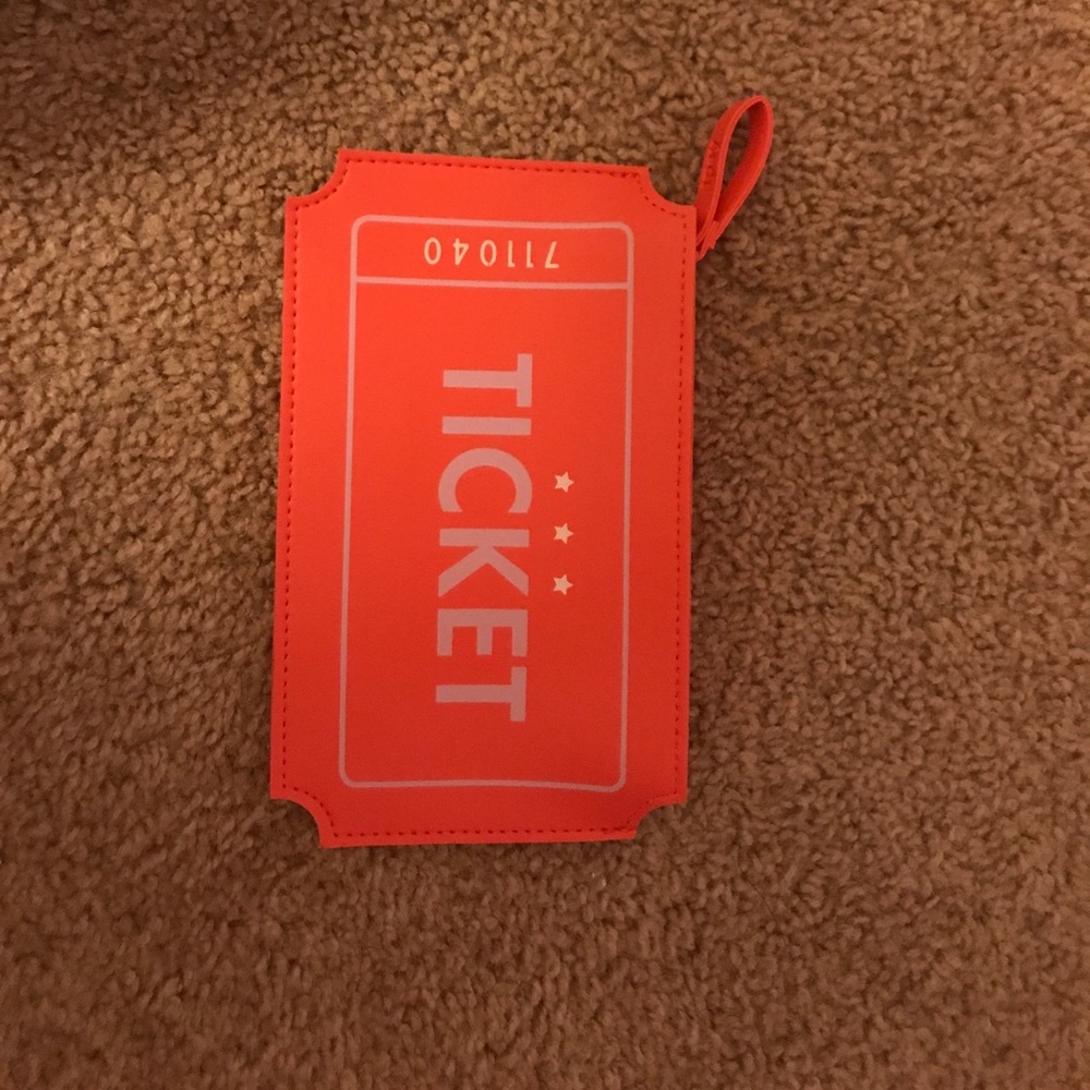 Coral wristlet. NWOT. Small black smudge on back.