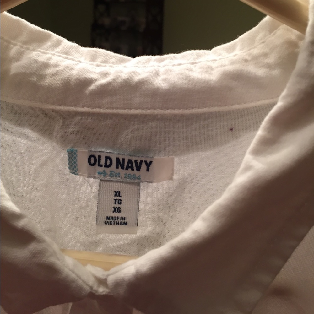 Classic white button up blouse.