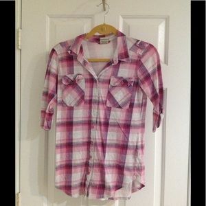Pink plaid button up shirt.