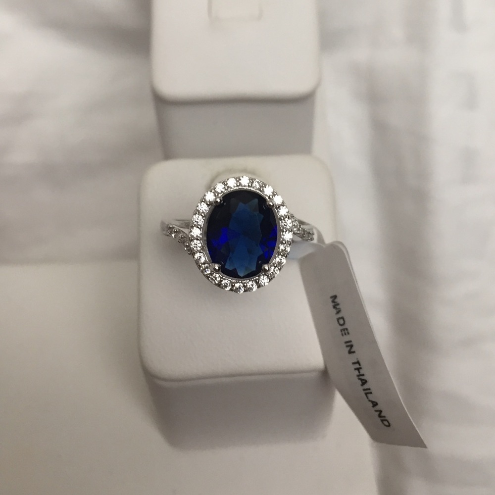 Simulated blue diamond halo ring