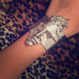 Abstract face silver bracelet/bangle.