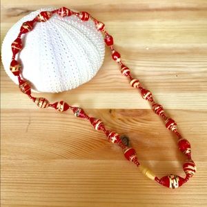 Red print varnished paper and glass beads necklace