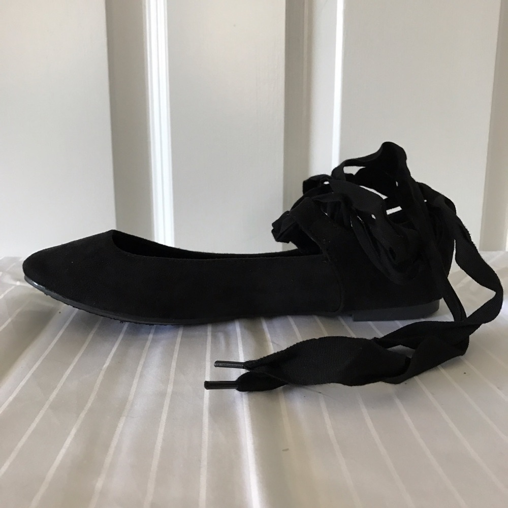 Black lace-up flats
