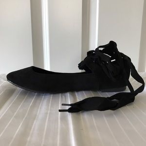 Black lace-up flats