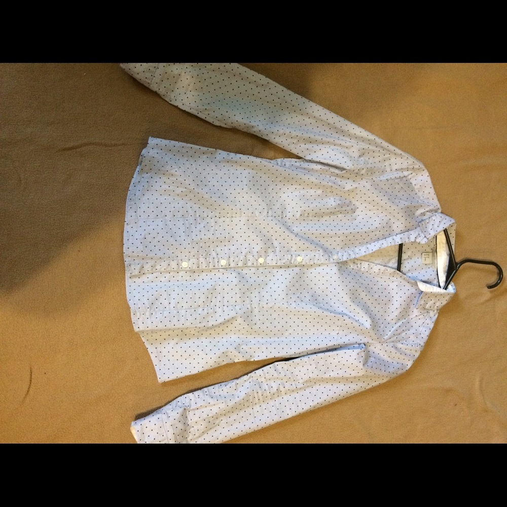 Baby blue shirt, with small  navy blue poker dots.