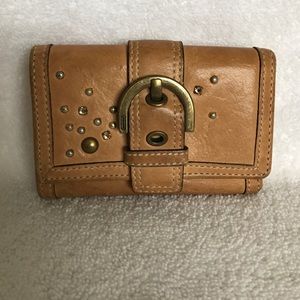 Coach trifold wallet with silver stud detail