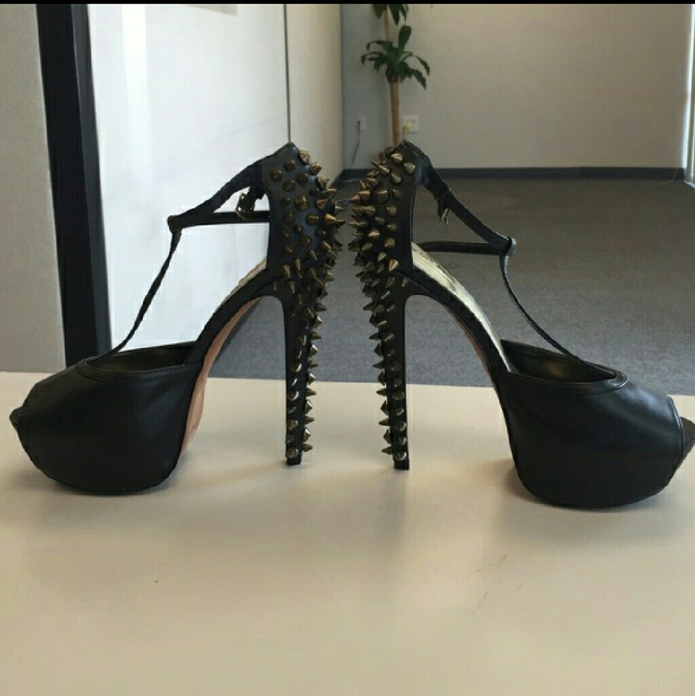 Black gold studded 6 inch heel with wedge toe.