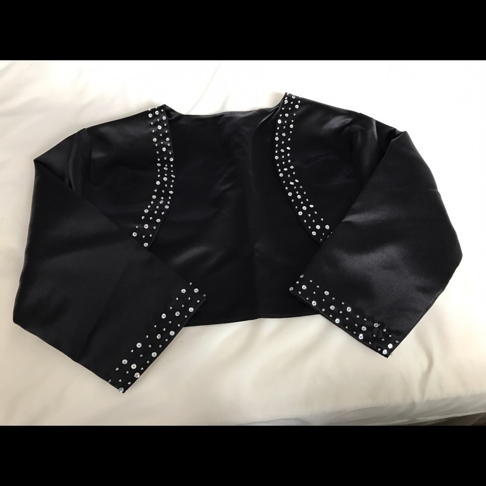 Black satin shrug with crystal detail.  Brand-new