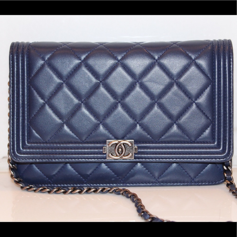 Authentic navy Chanel Boy wallet on a chain