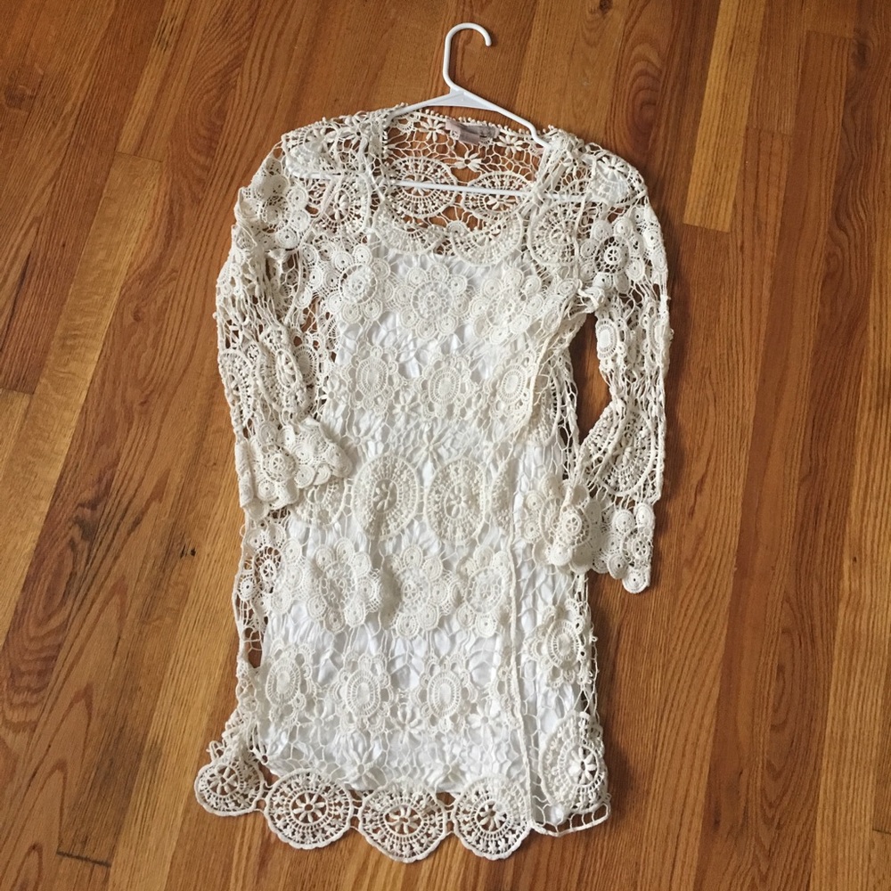 Long sleeve ivory crochet dress.