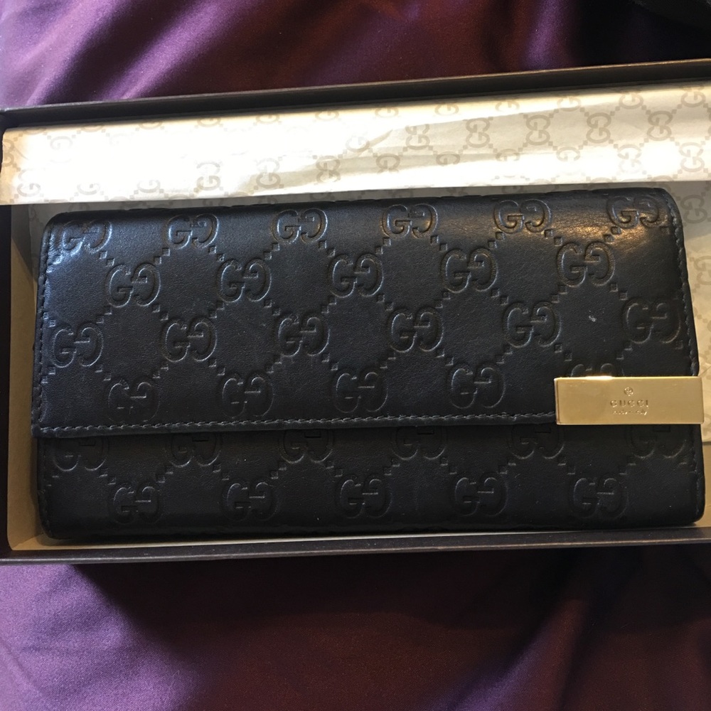 Gucci leather monogram wallet