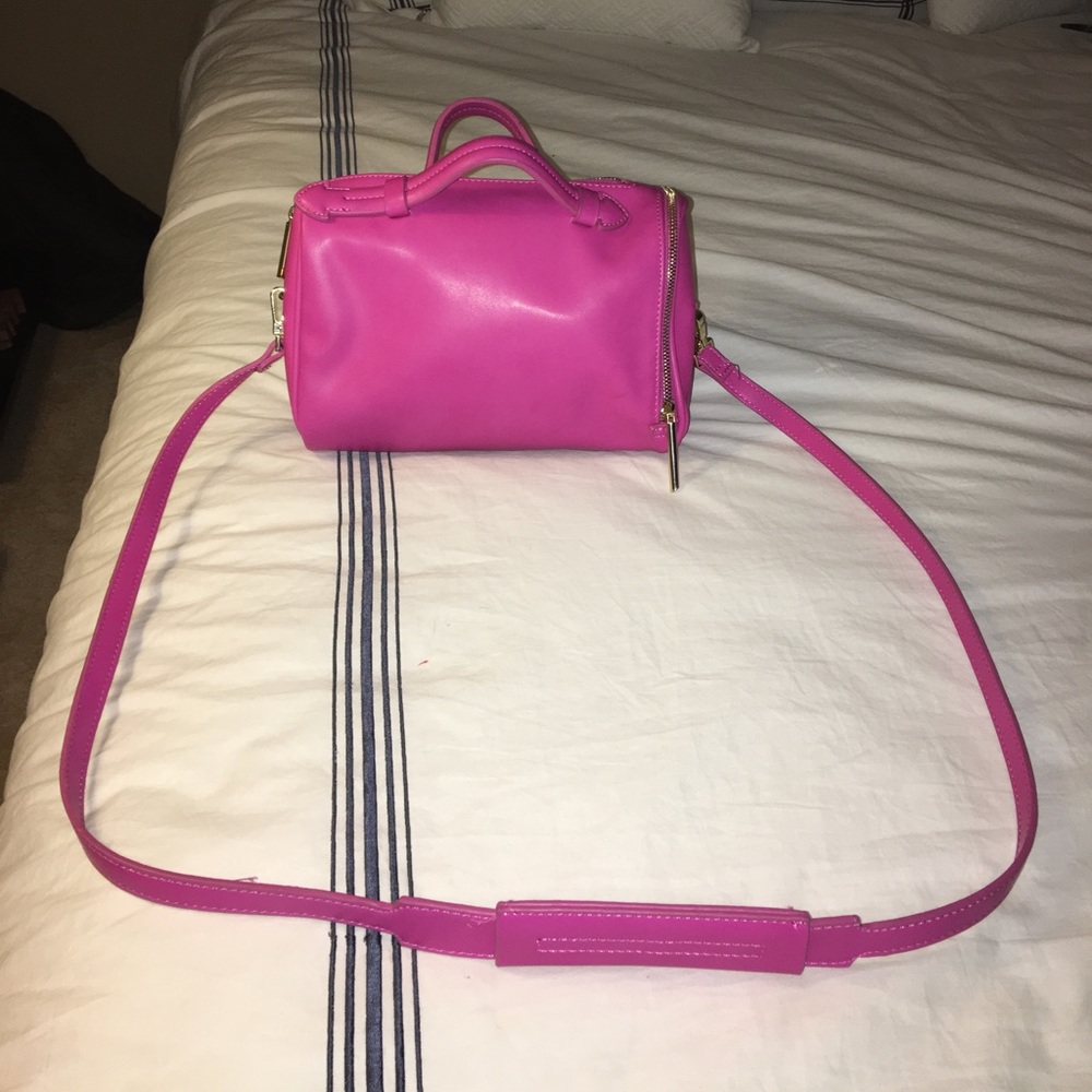 Small magenta crossbosy bowling bag purse