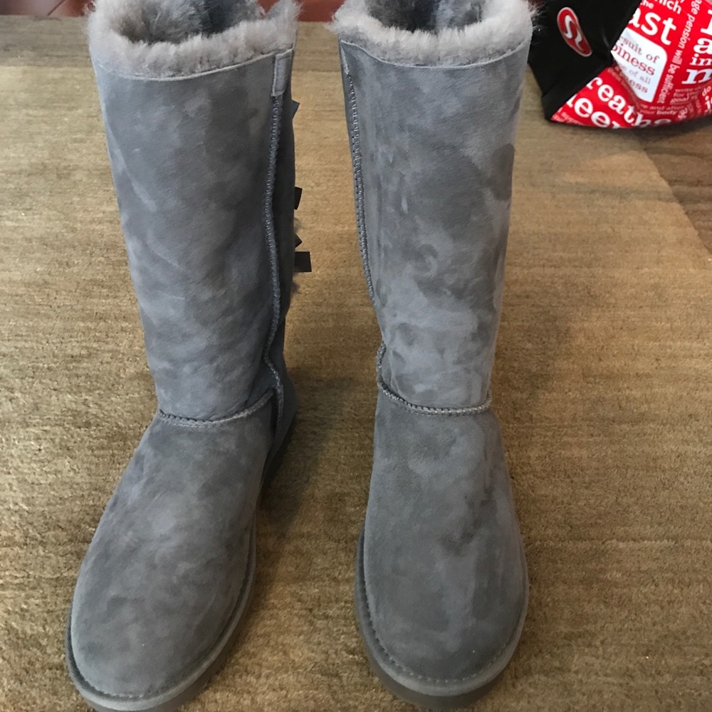 New, genuine UGG Tall Bailey Bow boots.