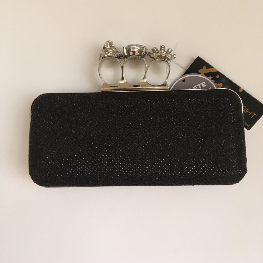 Cute black clutch, brand new with the tag