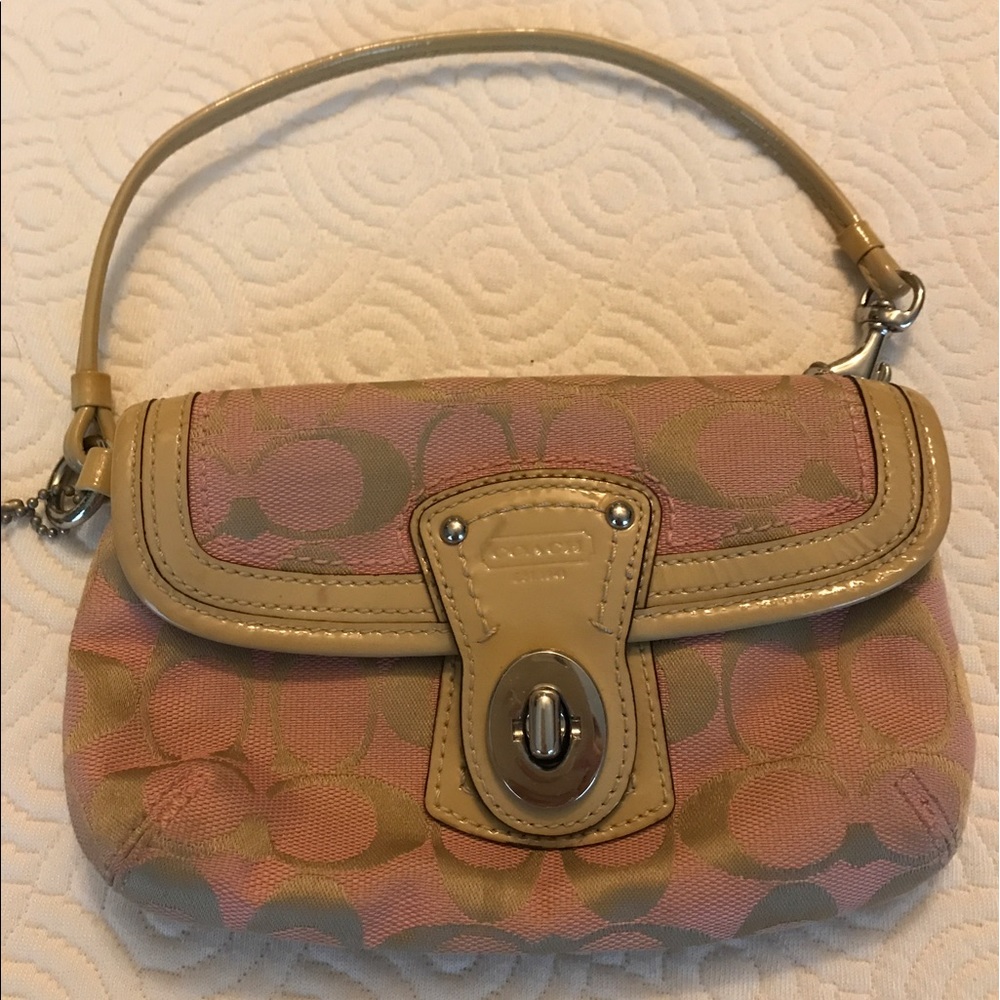 Pink and tan Coach wristlet