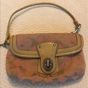 Pink and tan Coach wristlet