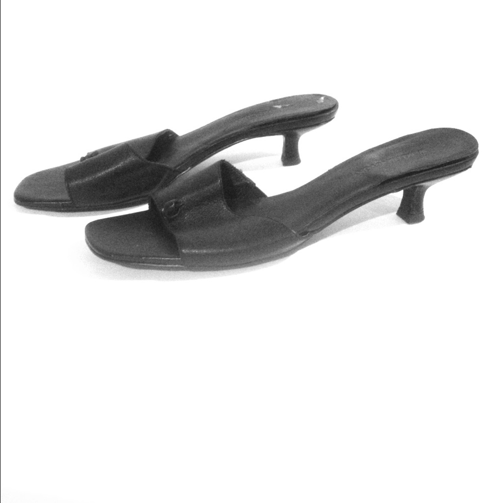 Well-worn heeled sandals, cute used heels.