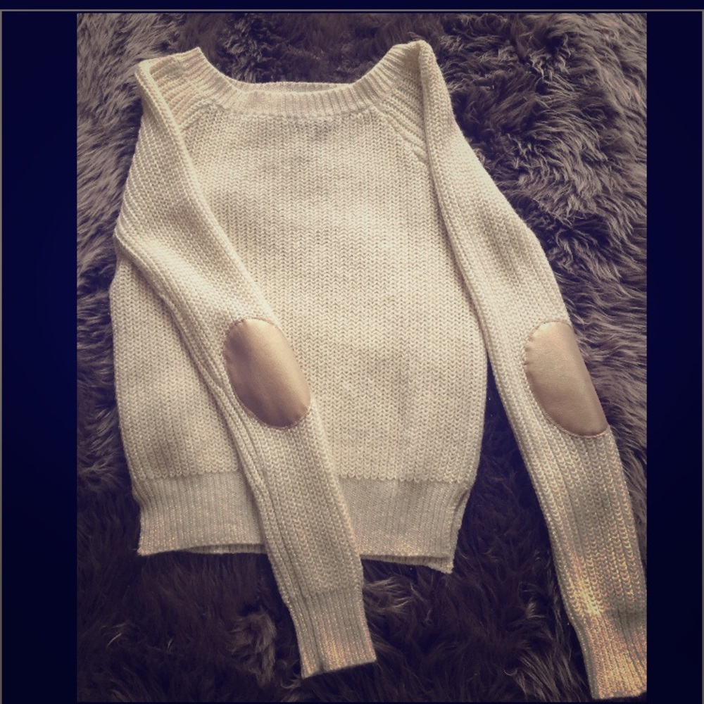 Sweater with  gold elbows  patches.