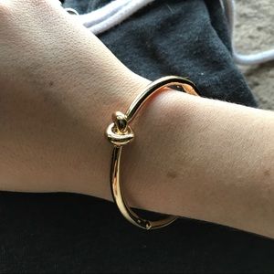 Kate Spade gold tone knot bangle bracelet