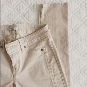 Beige skinny jeans.