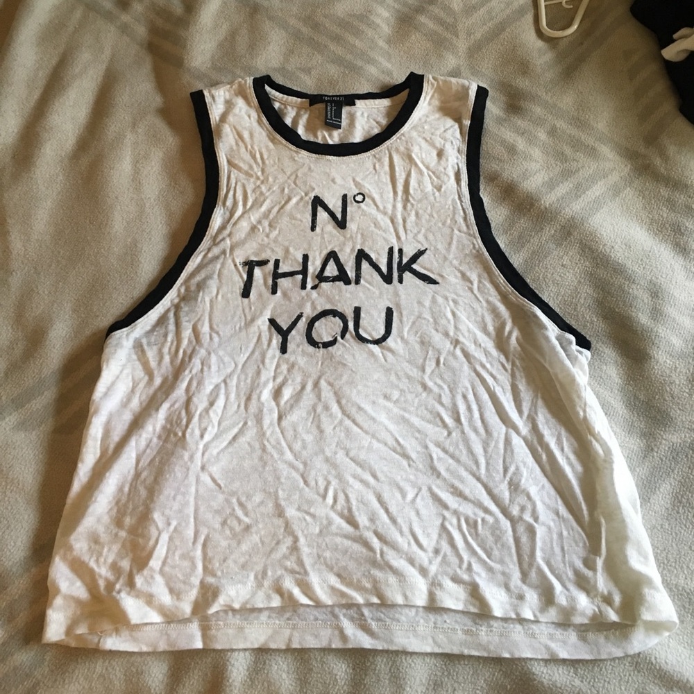 Tank top with black piping around arms and neck