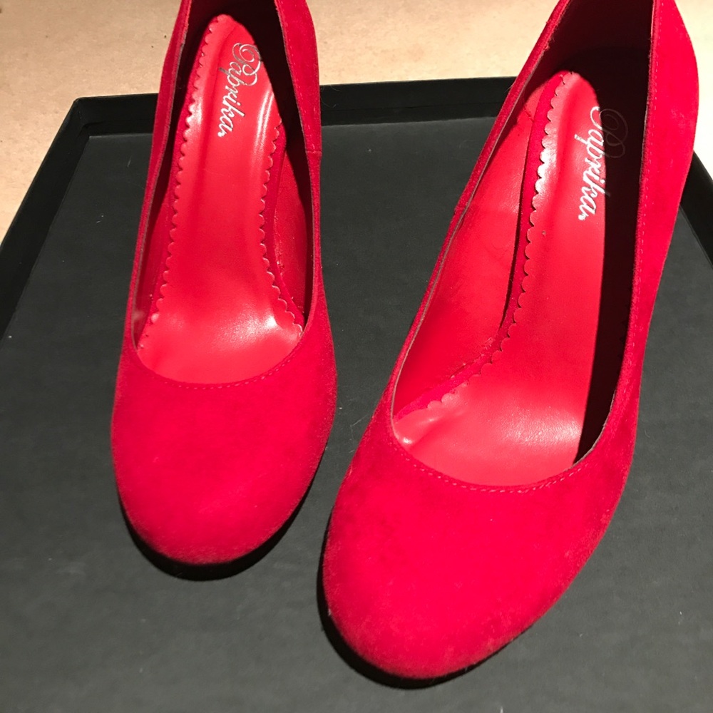 Red suede pumps