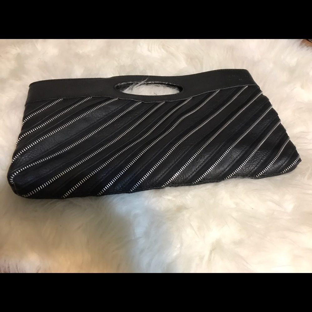 Faux leather clutch with exposed zipper detailing