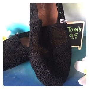 Toms black Lacey looking fabric.